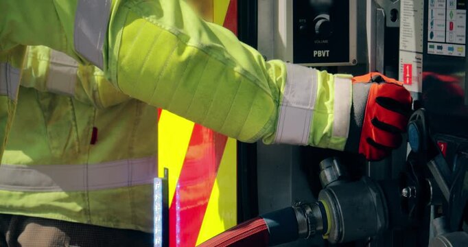 Firefighter crew &ndash; emergency service fireman rescue in action. Firefighting team in uniform in response to fire by fire engine truck.
