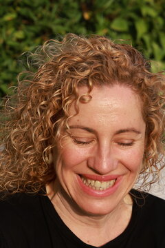 Smiling Woman Enjoying a Sunny Summer Day by the Pool