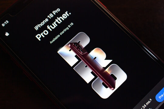 Quetzaltenango, GUATEMALA - Sep 15 2026 : Close-up of a smartphone showing the Apple iPhone 18 Pro launch page, with a burgundy handset over large silver lettering and the Pro further tagline.