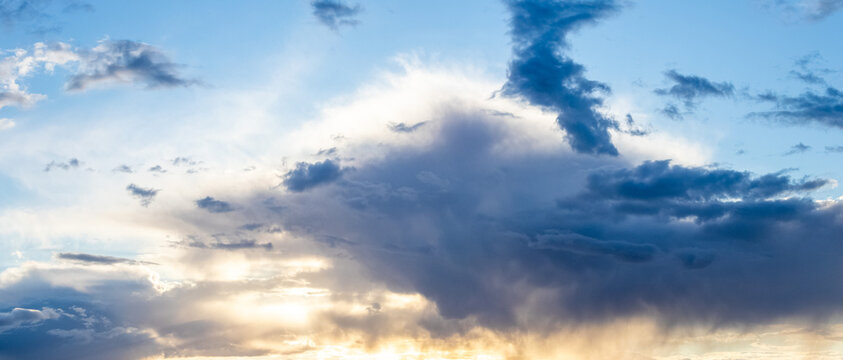 Dramatic sky with clouds and sunlight during sunset