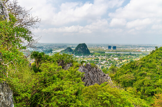 A view overlooking the surrounding landscape from the Marble Mountains in Da Nang, Vietnam on a bright sunny day