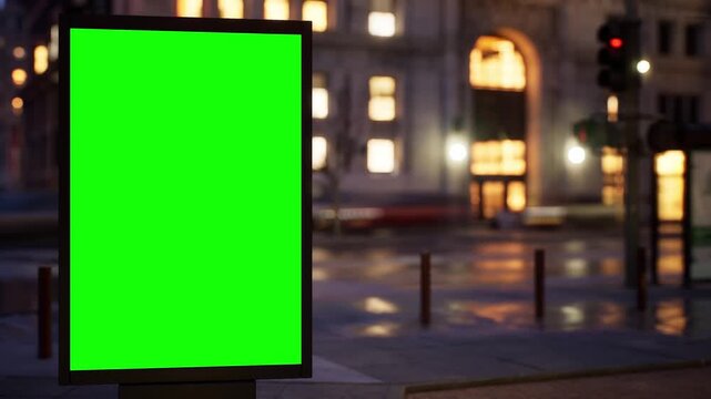 Empty chroma key advertising panel standing on a busy city street at night with glowing windows and street lights, cloudy sky. Cars rush by in a timelapse while the green screen stays sharp and ready