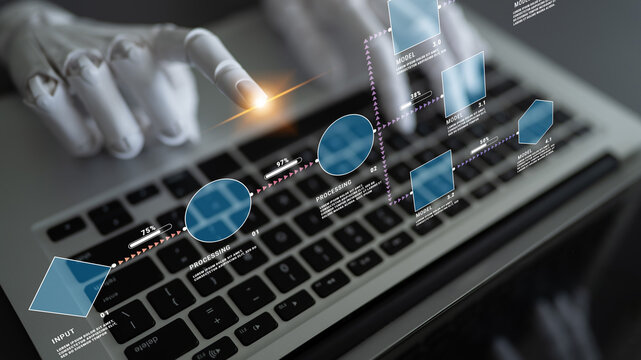 Futuristic robotic hand interacts with digital interface above laptop keyboard, showcasing technology integration and data analysis concepts in modern workspace Quark.