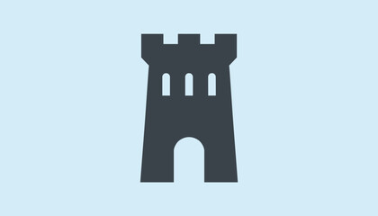 Obraz premium Simple grey silhouette of a fortified castle tower with windows and an arched entrance against a light blue background.