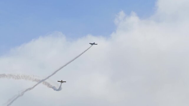 Acrobatic airplanes performing an airshow maneuver