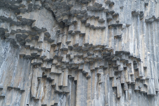 Geological formations of basalt columns in Armenia display unique patterns and textures, highlighting the natural beauty of stone structures in the landscape