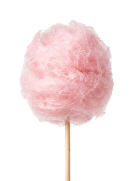 Fluffy pink spun sugar cotton candy on a wooden stick presented as isolated on transparent background