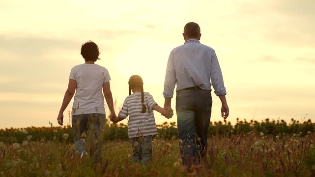 Family Walks child girl kid childhood dream outdoors Sunset, Parents mother father man woman parent Child Holding Hands Nature, Happy Family Time Together, Togetherness Countryside, Peaceful Evening