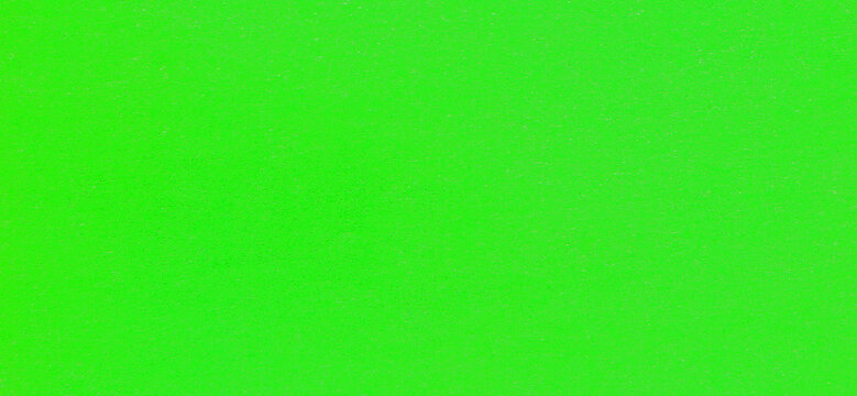 Bright-green surface of old paper material, background, texture. Backdrop of acid-green cardboard surface. Ultra-green paper wall, cover. Fluorescent green colored paper surface. Lime-green backdrop