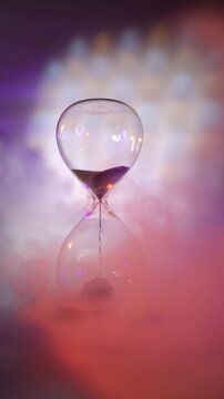 An hourglass on a wooden stand, framed by swirling smoke, is a vivid metaphor for the fleeting nature of time.