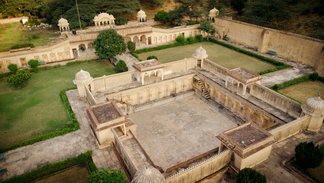 Aerial view of Sunar Bagh with its historic stone architecture, arched pavilions, and manicured gardens in Jaipur, Rajasthan, India.
