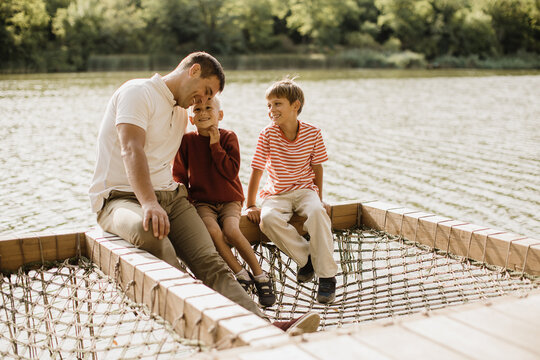 Family fun at the lake brings laughter and joy among the trees