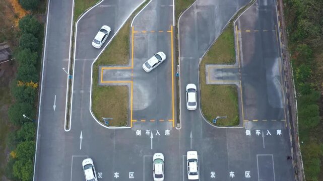 Aerial View of Cars Practicing Reverse Parking on a Driving Test Track