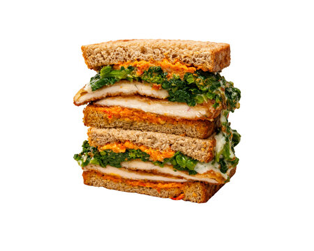 Chicken cutlet sandwich on whole wheat toast with broccoli rabe sundried tomato spread and melted provolone cheese