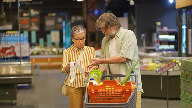 Stressed senior couple shocked by high prices in supermarket