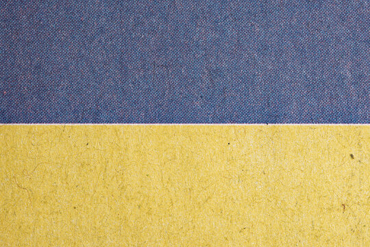 Macro Newspaper Print Paper With Blue and Yellow Bands