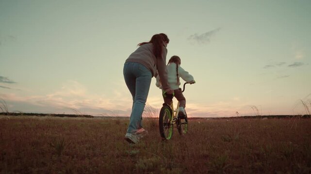 Empowering daughter outside, Life&rsquo;s first lessons, Safe hands, Childhood adventure, Warm rays of sun, Field of dreams, Parenting with love, Learning balance, Meaningful connection, Hopeful horizon