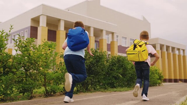 First day at school, Energy and happiness, Kids ready for new challenges, Walking to school with confidence, Backpacks full of dreams, School entrance ahead, Friends keeping pace, Childhood adventures