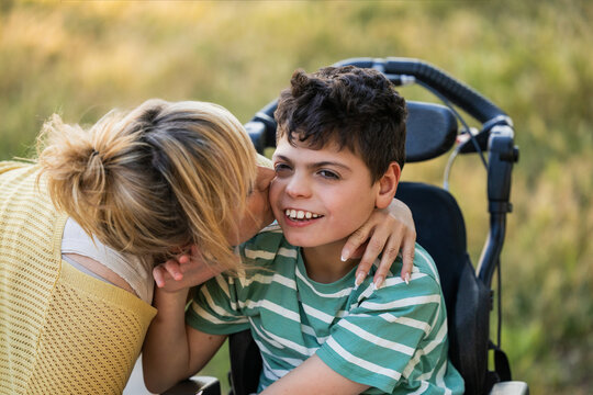 Mother showing love and support for son with cerebral palsy