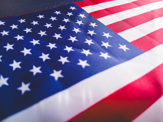 Fototapeta premium Close up of the American flag with stars and stripes texture. USA Memorial day, Presidents day, Veterans day, Labor day, or 4th of July celebration. 