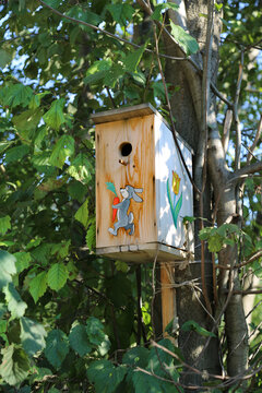 Wooden birdhouse with a pattern on a clear sunny day. Sights of Russia, World tourism.