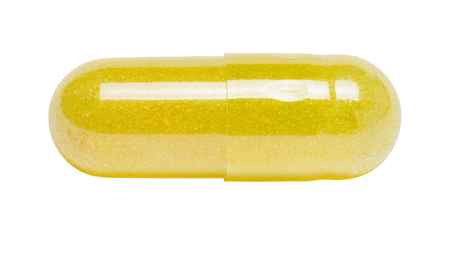 Yellow translucent capsule with granular contents, isolated on transparent background