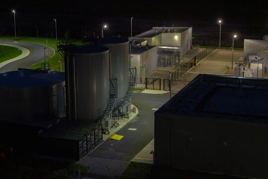 Aerial view of advanced power and safety management systems for a hyper-scale data center with industrial storage tanks.