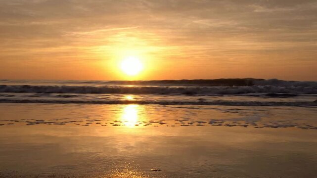 Golden sunset over tropical ocean waves: serene beach horizon at dusk sunrise
