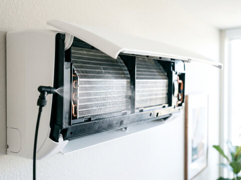 Steam cleaning heat exchanger coil fins of open indoor air conditioner split system