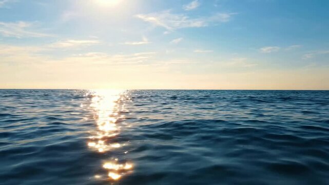 Golden sunset over calm ocean waves, serene sea horizon at dusk, relaxing tropical water background sunrise