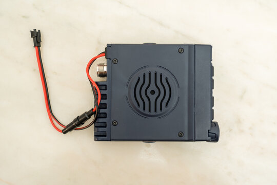 Small CB radio with sideband and female PL plug, safe in hand.
