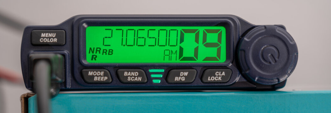 CB radio tuned to channel 9 in AM, emergency.