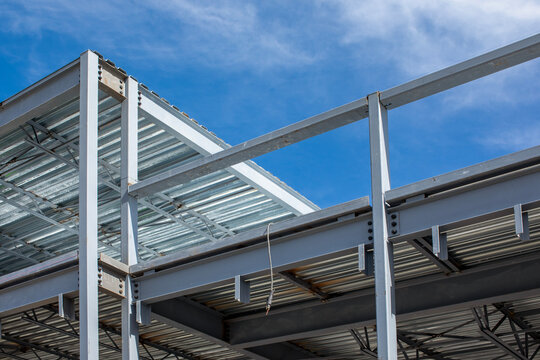 Structural steel framework building with corrugated metal decking and concrete block wall