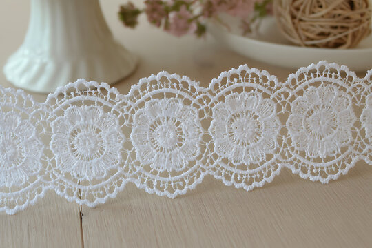 Floral lace border with scalloped edges in white