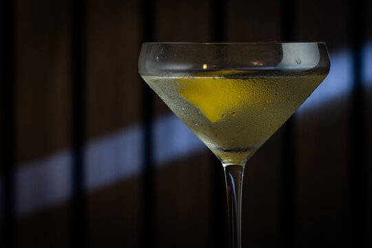 Elegant cocktail in a martini glass. The classic Vesper Martini, stylized background adds moody sophistication. Ideal for upscale bar or cocktail menus