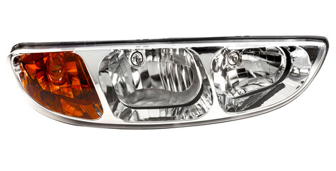 New car headlight assembly with an amber turn signal indicator and chrome reflectors, isolated on a white background. © lcrribeiro33@gmail