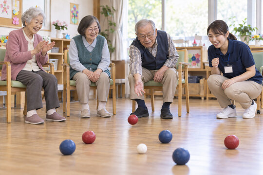 Japanese seniors enjoying boccia recreation at an adult day care center