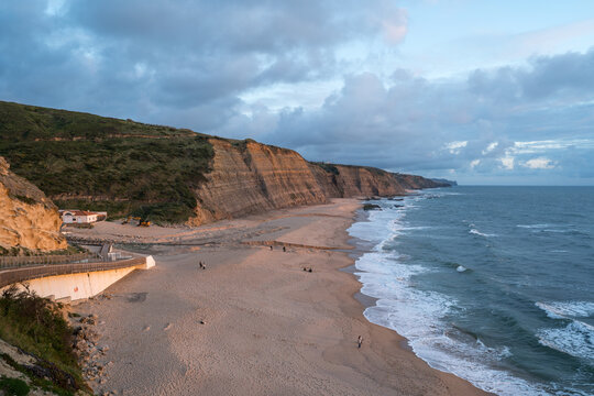 Coastal Cliffs and Beach with Wooden Walkway at Magoito Beach Portugal