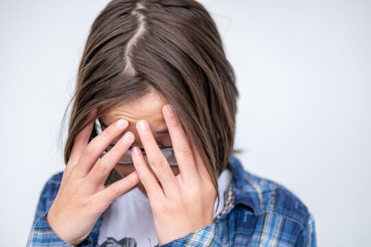 Stressed teenager, feeling pressure and isolation, boy, 13-year-old child in distress, mental fatigue, concept mental health, adolescence struggles, loneliness, outsider emotions, anxiety, burnout