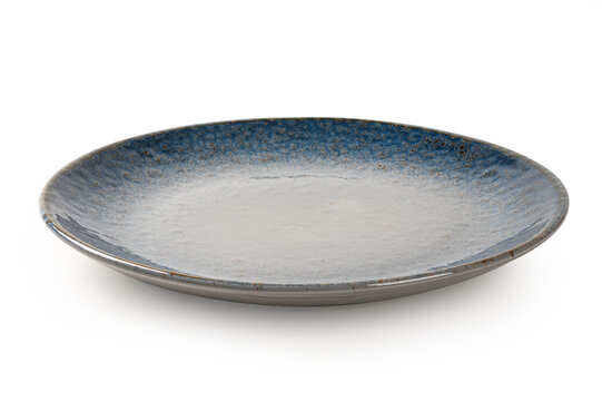 Round ceramic dinner plate with a unique blue and sand-colored speckled glaze. Modern minimalist tableware for professional food presentation, isolated on  white background.