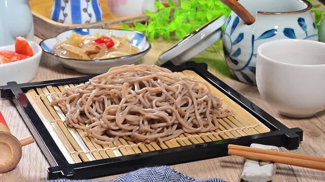 Japanese buckwheat soba noodles with soy sauce and chopsticks