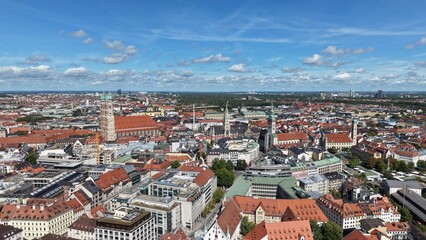 Obraz premium Aerial footage from St. Paul's Church in Munich, Germany. Cinematic drone shot revealing the neo-gothic architecture, green spires, and urban city skyline.
