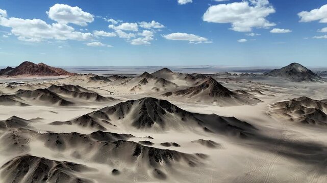 Black Dushan rolling black mountain range landscape