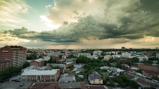Time Lapse of Cityscape at Sunset with Dramatic Moving Clouds Over Urban Residential Area