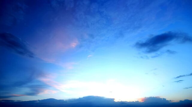 Time-lapse of dramatic sunset sky with fast-moving clouds and vibrant blue-to-pink gradient