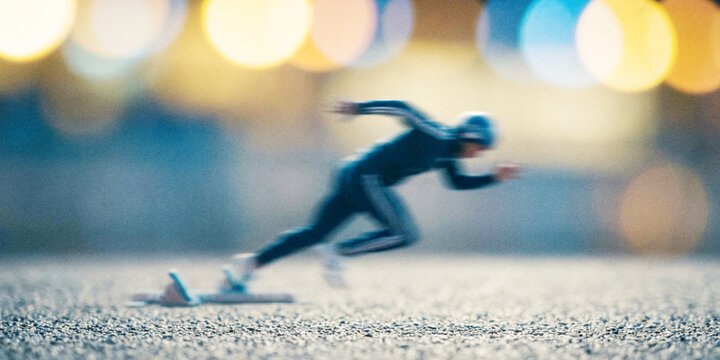 A blurred image of a sprinter in motion, emphasizing speed and athleticism against a backdrop of colorful lights. Captures the essence of competition and determination.