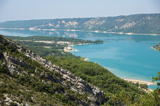 Lush Lake Surrounded by Mountains and Forests