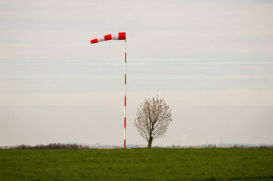 Windsock on Field with Isolated Tree Background