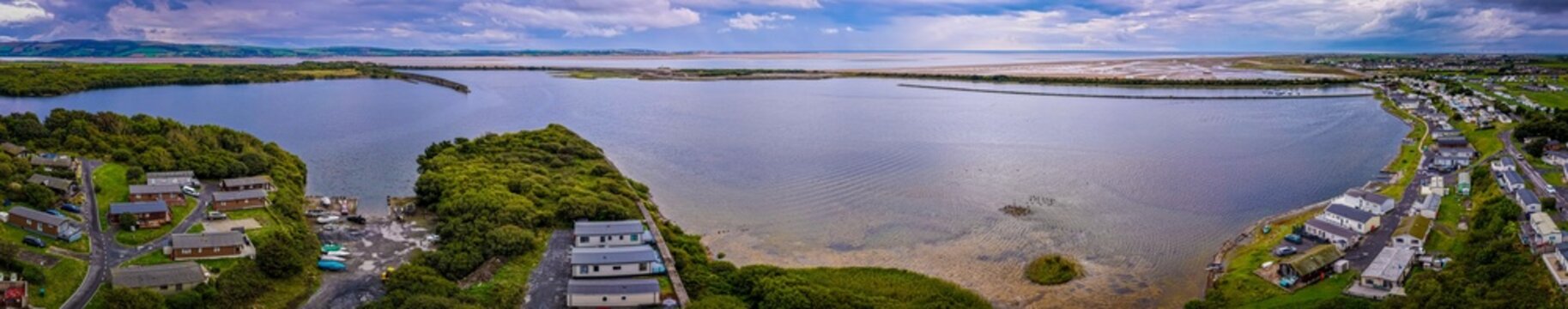 Haverigg Village Waterfront with Church and Lakeland Fells in Cumbria England