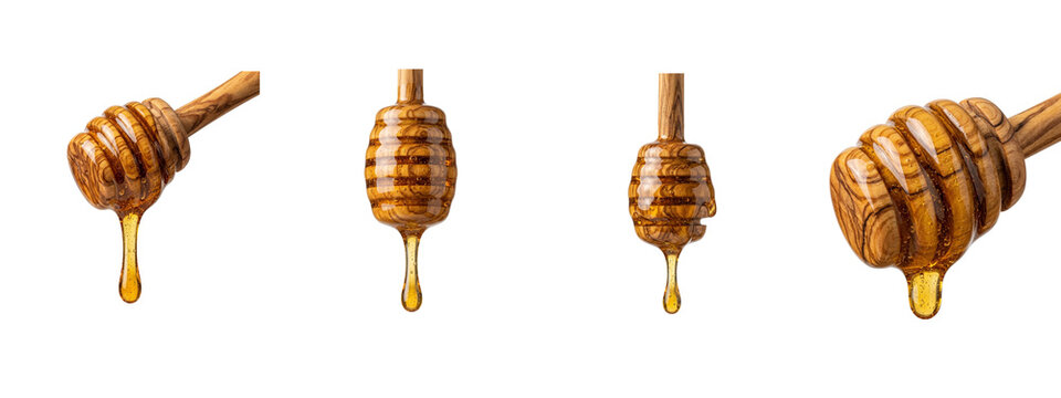 Wooden honey dippers with dripping golden syrup isolated on transparent background